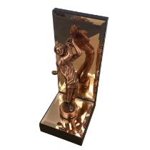 A bronzed colour model of a male golfer, mounted on a mirrored stepped base and nack