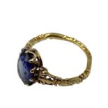 An 18th Century and later unmarked yellow metal mourning ring, with later added central oval
