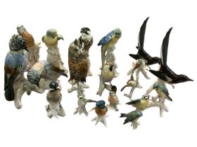 A quantity of Karl Ens ceramic bird figurines, mid C20th,