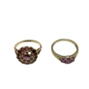 A 15ct gold and garnet set dress ring(two vacant settings) together with a 9ct gold gem set three