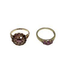 A 15ct gold and garnet set dress ring(two vacant settings) together with a 9ct gold gem set three