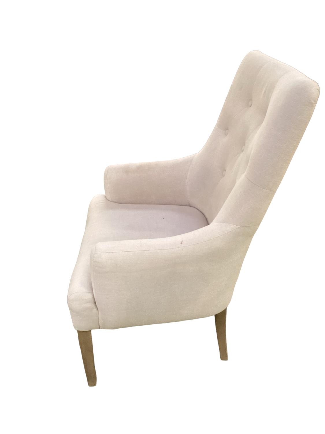A modern cream upholstered button back chair, raised on wooden feet, some areas of wear/marks - Image 3 of 3