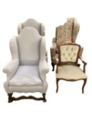 Two winged high backed arm chairs in grey fabric (with wear to upholstery), and a similar arm