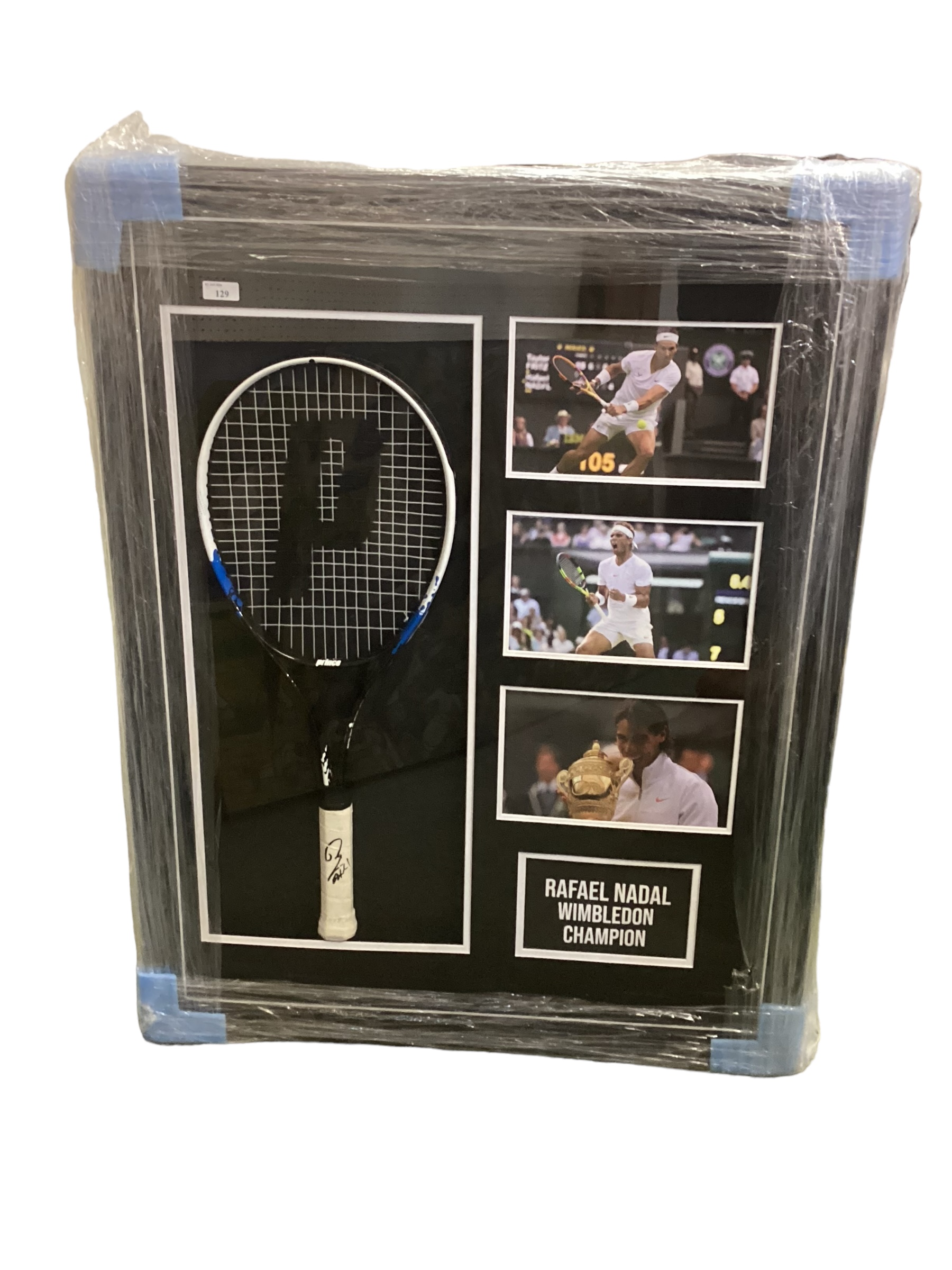 A framed and glazed COMMEMORATIVE TENNIS: Rafael Nadal Wimbledon Champion, with a signed Prince