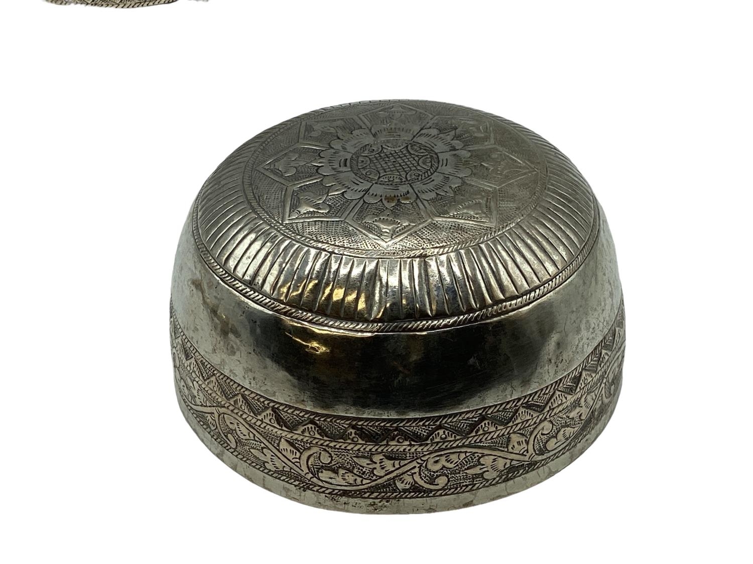 A pair of South Asian style white metal bowls with chased decoration together with a set of white - Image 3 of 4