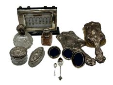 A collection of sterling silver dressing table items. Desk calendar etc.