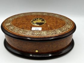 A Sorrento ware style oval lidded music box.