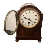 A mahogany cased arched mantle clock, with bun feet, 22cmH