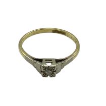 An 18ct gold and platinum single stone diamond ring. Size N. 2.00g.