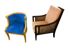 A large square framed arm chair, with bergere caned seat, back, and sides, to tapering legs and