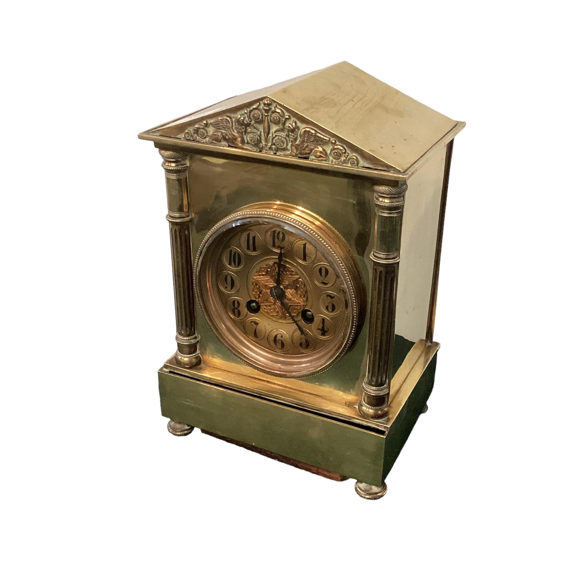 A C19th brass French mantle clock in the Adam style, 25cm H
