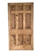 A large pine door, sold as seen with imperfections, 114cm w x 212 cm h x 5 cm thickness,