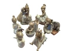 A collection of seven Lladro figures.