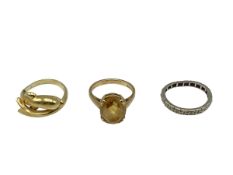 A 14ct gold dolphin ring together with a 9ct Citrine set ring and a white metal band. total 8.9g.