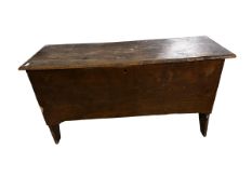 An small coffer chest with rising lid, and on four raised panel legs, some wear and losses