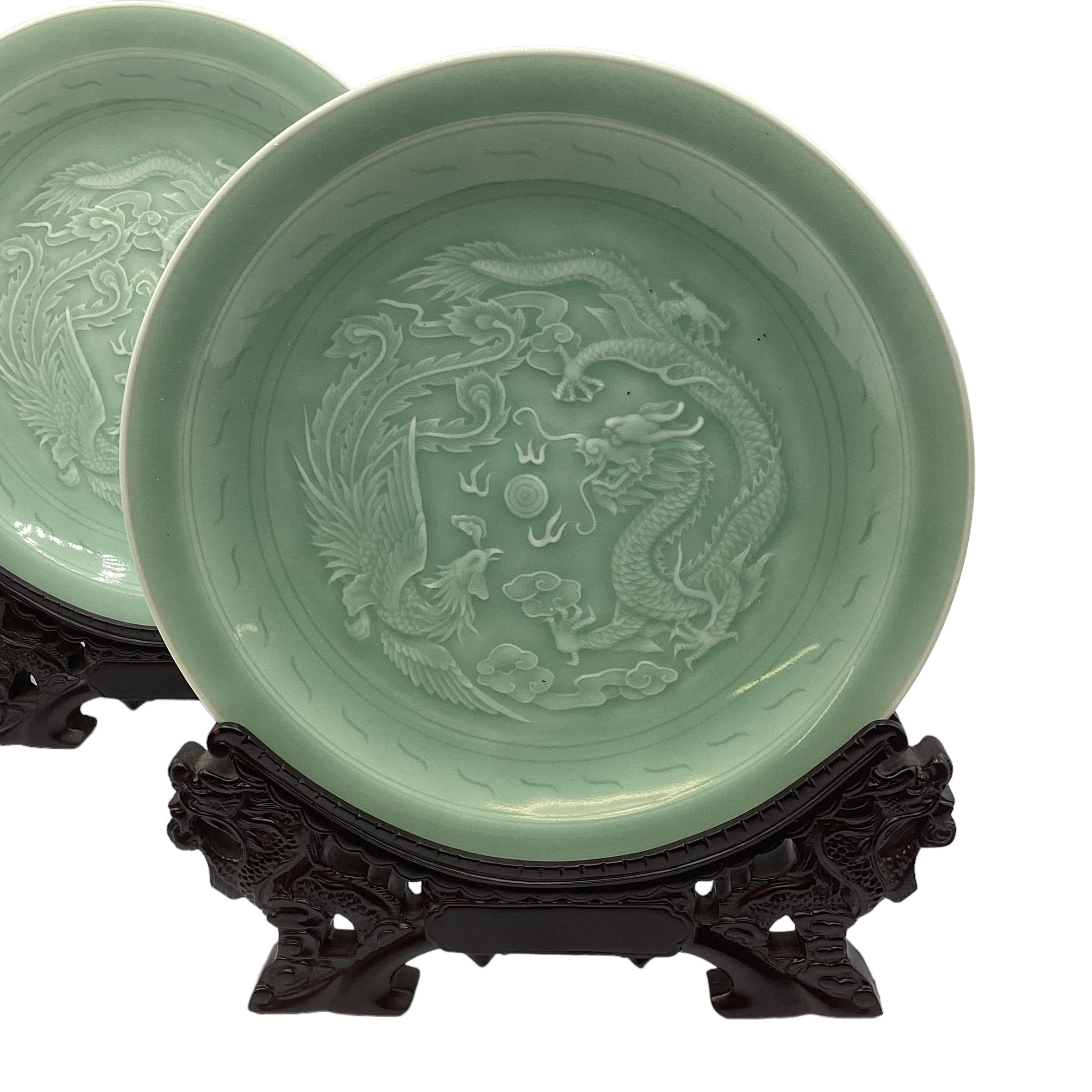 Two Chinese celadon chargers in presentation boxes stylised phoenix and dragon decoration with - Image 9 of 10