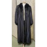 A ladies long black fur coat, labelled Grosvenor Canada at Zwirn, in good condition