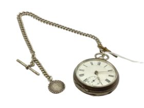 A 935 silver key wind pocket watch with silver albert and T bar. With key,