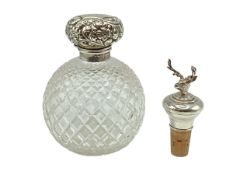A sterling silver topped dressing table scent bottle together with a sterling silver wine bottle