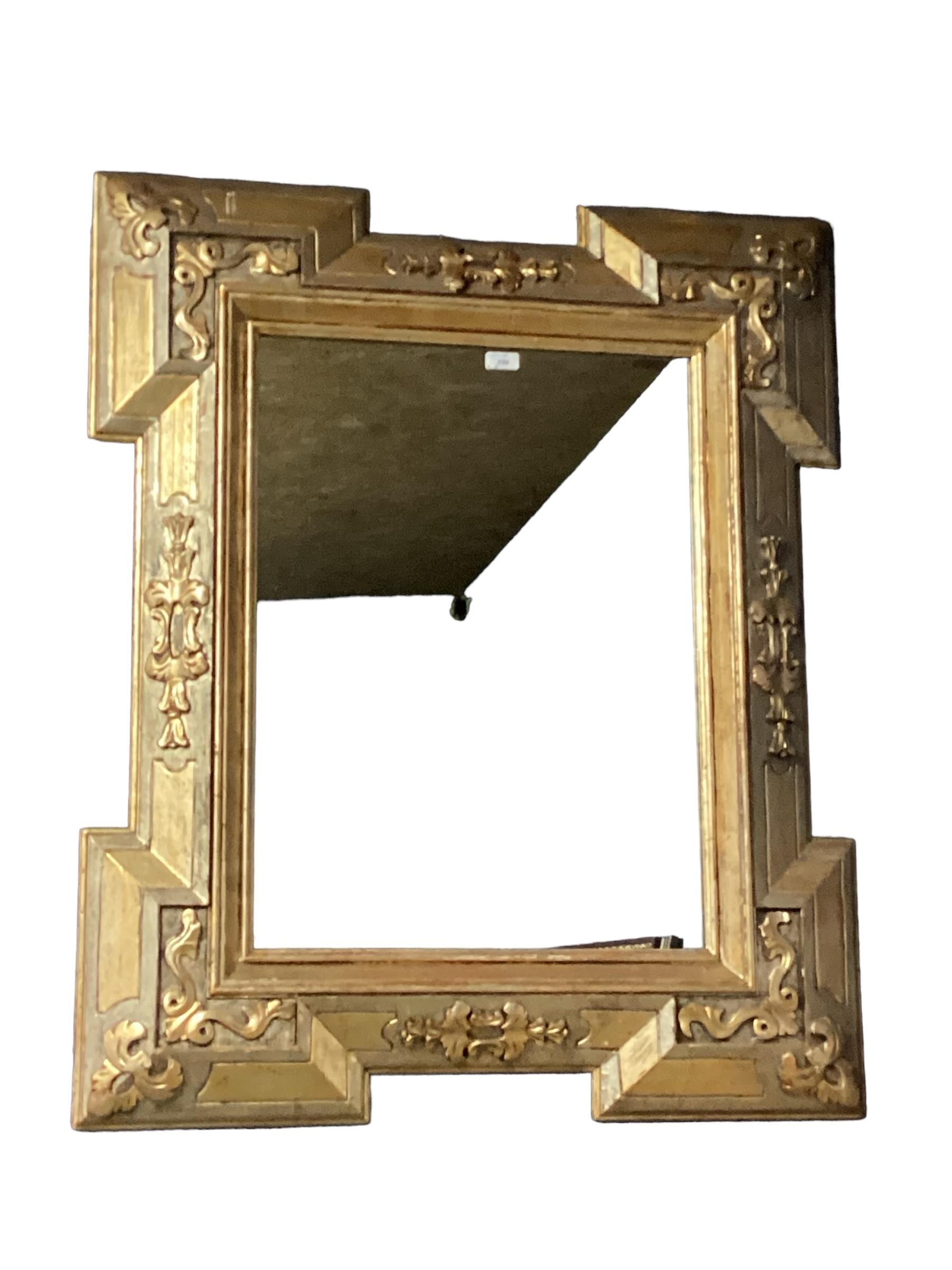 A contemporary rectangular gilt framed wall mirror, with floral pattern to mount, 100cmH x 83cm W,