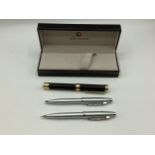 A cased pair of Sheaffer pen set and unusual pen shaped magnifying glass