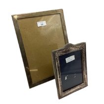 Two sterling silver mounted easel picture frames. 27cm x 20cm and 18cm x 13cm.