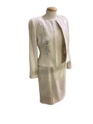 Catherine Walker, London. Cream wool dress and jacket, black silk skirt, beige three quarter