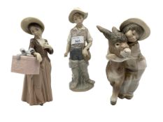 Three Lladro figures.