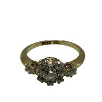 18 ct gold and diamond flower ring, central old brilliant cut, 4 mm diamond in an 8 prong setting,