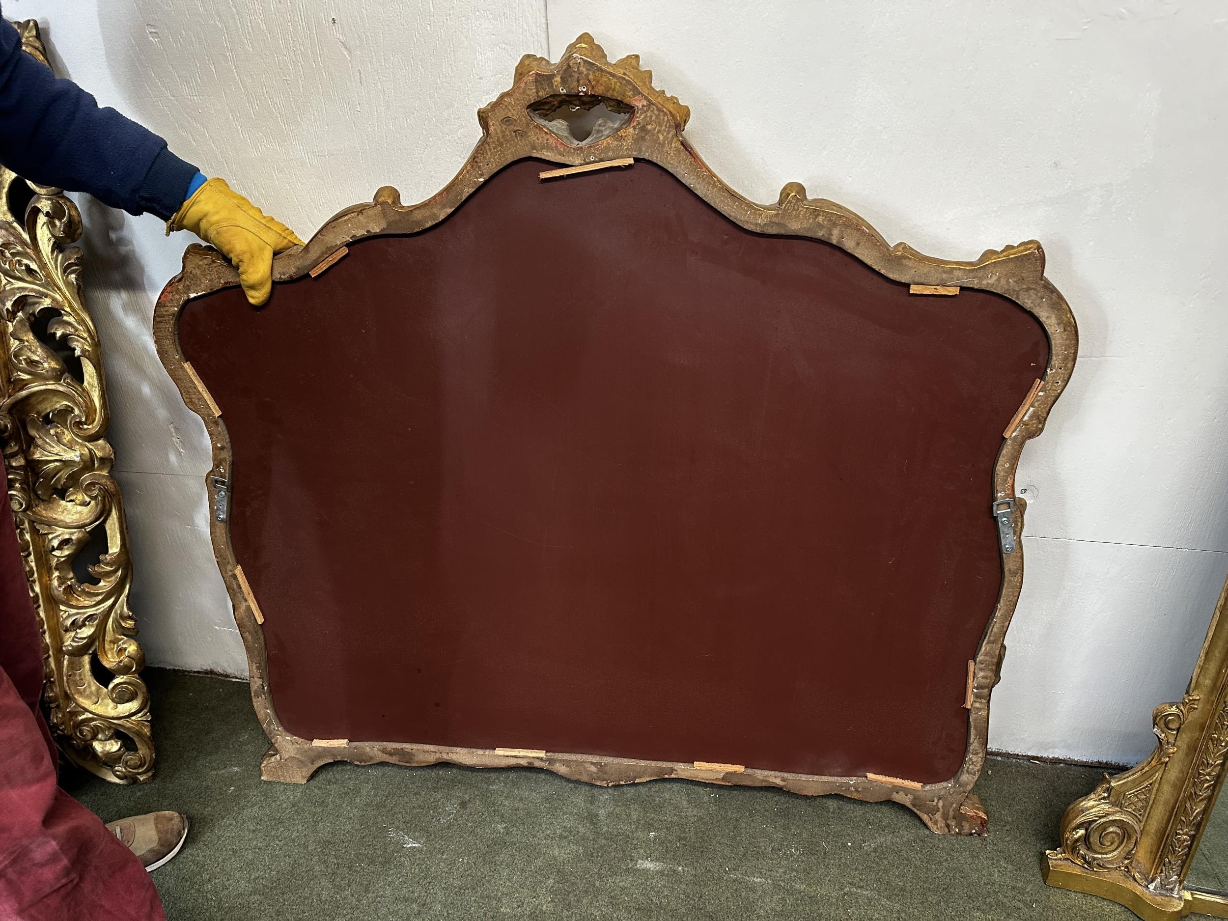A large decorative gilt wall mirror, in the Rococo style, overall 115cm High x 123cm Wide - Image 4 of 4