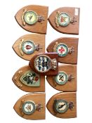 A quantity of wooden shield shape plaques with RAF insignia etc