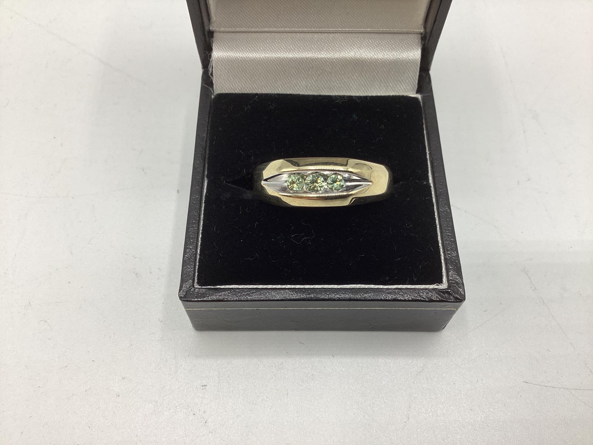 A Large 9ct gold ring with 3 stones, size V/W, total weight 5.3grams