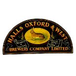 An arched shaped wooden sign, HALLS & OXFORD & WEST BREWERY COMPANY LIMITED, some general wear and