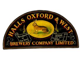 An arched shaped wooden sign, HALLS & OXFORD & WEST BREWERY COMPANY LIMITED, some general wear and