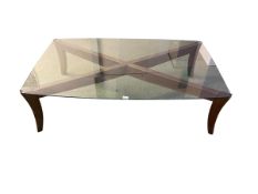 Natuzzi Italy late C20th teak style glass topped coffee table raised on sabre legs 141 cm x 88 cm