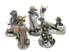 A collection of five LLadro figures.