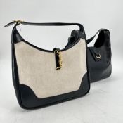 HERMES bags: one navy leather, with fabric strap, yellow metal buckle, in used condition and worn