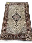 Silk on cotton Kashmir style rug with beige ground and floral border 143 cm x 218 cm