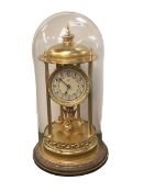 A West German anniversary mantle clock and glass dome, approx 40cmH
