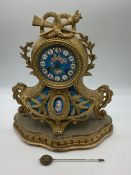 A French gilt metal mantle clcok on stand, with blue dial decorated cherubs, approx 33cmH