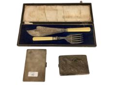 A cased fish knife and fork, a hallmarked silver cigarette case, and another cigarette case, all