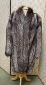 A ladies three quarter length fur coat, Grosvenor Canada at Harrods, Exclusive to Harrods, appears