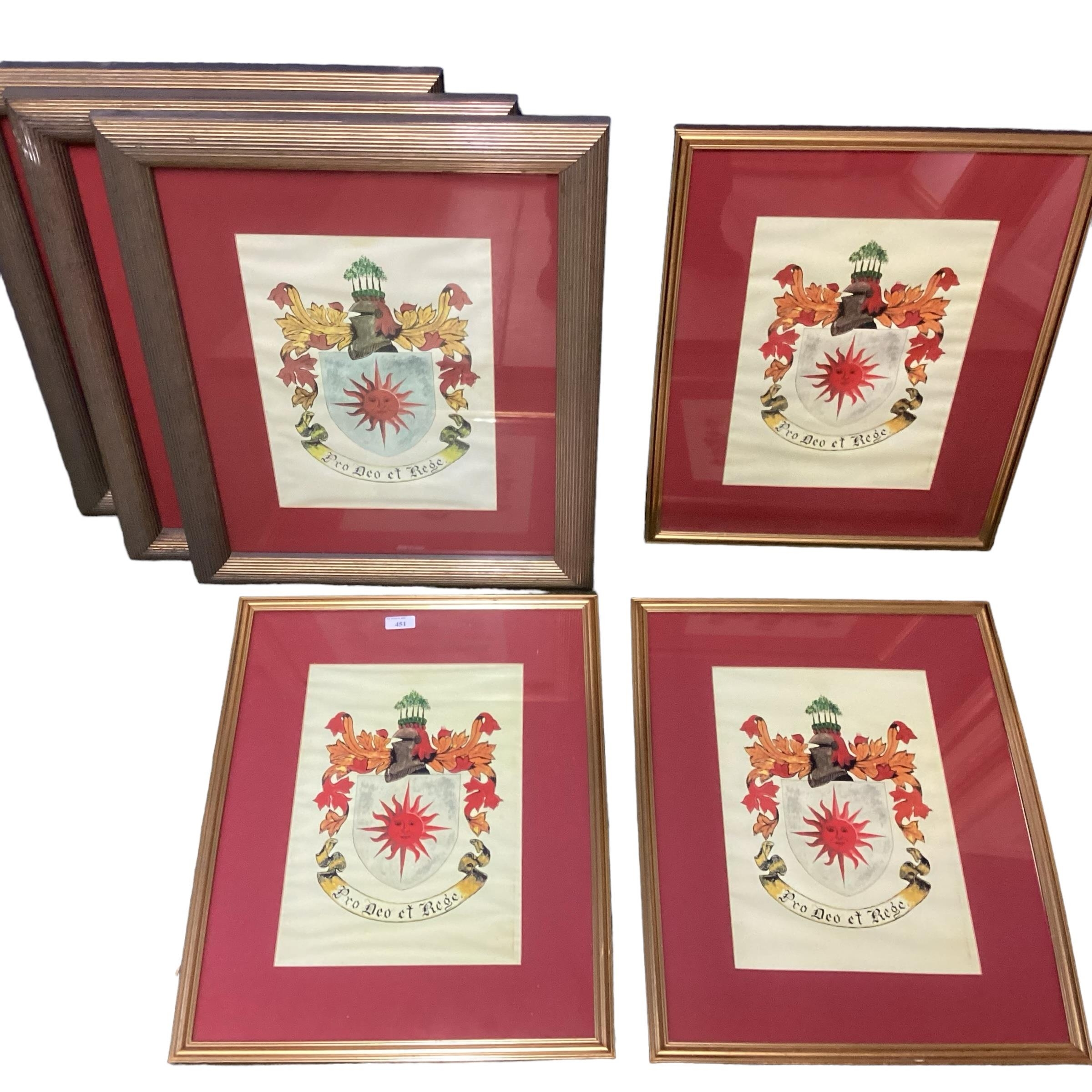 Six prints, framed and glazed of a family crest, some rippling to mounts, sold as seen