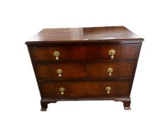 A small WARING AND GILLOW chest of three long drawers with brass drop handles; all over general