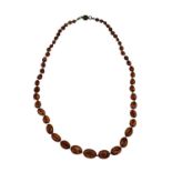 A graduated amber bead necklace. 56cm. Approx 5g.