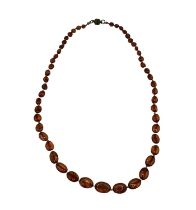 A graduated amber bead necklace. 56cm. Approx 5g.
