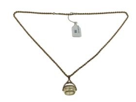 A 9ct gold rope twist necklace. 82cm, 20.53g. Together with a 9ct gold mounted citrine swivel