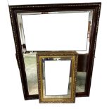 A modern large wooden and gilt patterned framed wall mirror, and another small gilt framed style