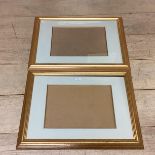 A pair of modern gilt glazed frames, empty, overall 52cm x 86cm W