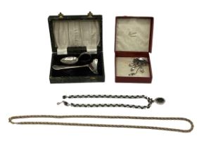 A Christian Dior gilt metal rope twist necklace together with a paste set brooch and necklace suite.